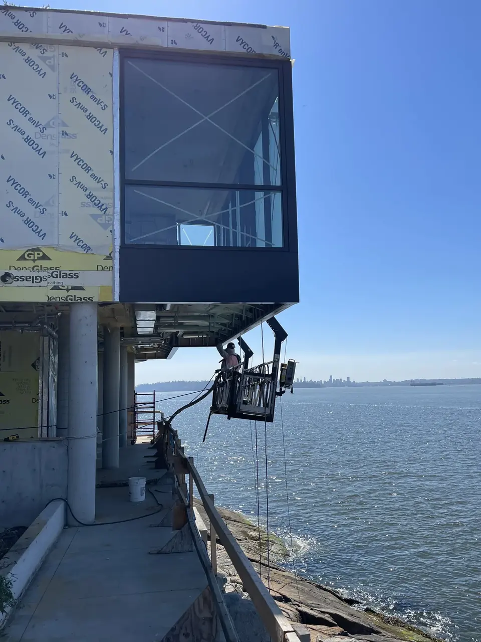 Waterfront commercial building envelope project during construction.