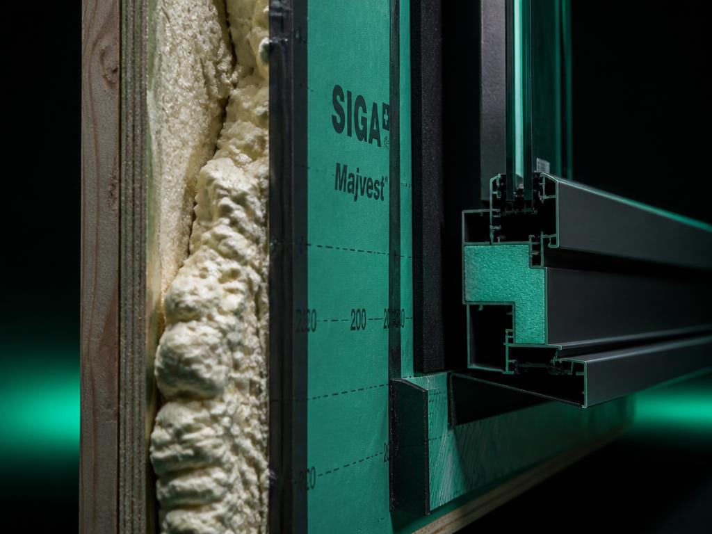 Close-up of a continuous air barrier and insulation assembly.
