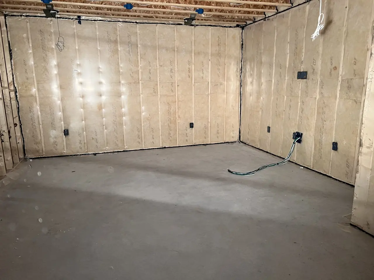 Insulated interior wall assembly in a new residential build.