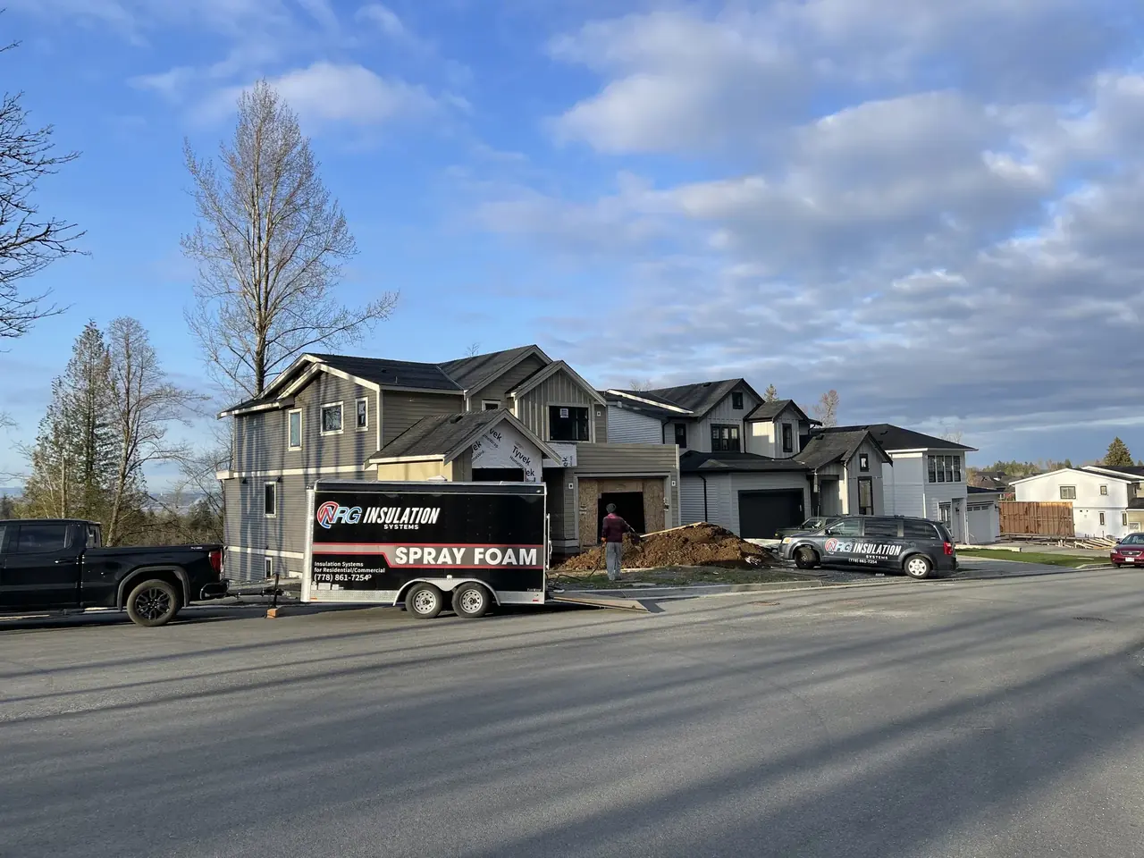 NRG spray foam crew working at a residential construction site.